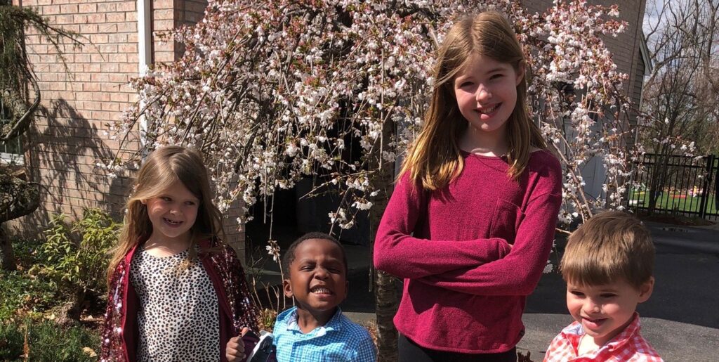 boy adopted with siblings